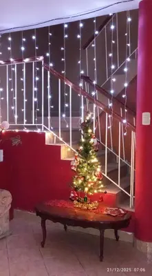 a christmas tree sitting on a table in a room at Departamento 6p Tierra del Sol Eterno - Ica centro in Ica
