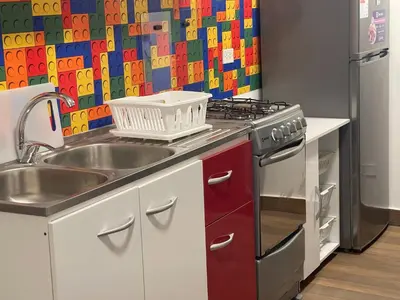 a kitchen with a sink and a stove at 17 Dpto con inmejorable ubicación Miraflores in Lima