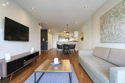 a living room with a couch and a table at Alcanfores 1262 by Wynwood House in Lima
