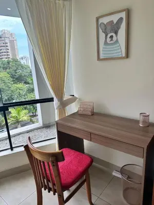 a desk with a chair next to a window at Bonito depa san isidro cama queen home office wifi y cochera in Lima