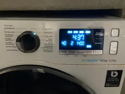 a close up of a washing machine with a clock on it at Departamento Cool & Comodo, San Isidro in Lima