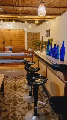 a room with blue vases sitting on a counter at VIVEMAR PUNTA HERMOSA - Beach House Lima - Perú in Punta Hermosa