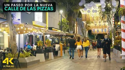 a group of people walking down a street at II Habitación Privada en Miraflores Central City in Lima