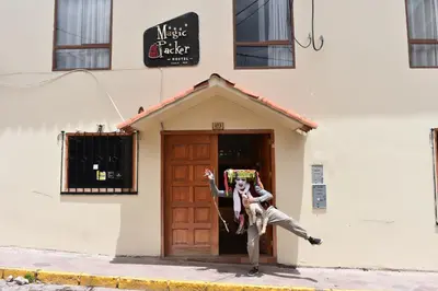 a couple of people standing outside of a building at Magic Packer Hostel in Cusco
