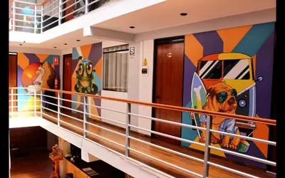 a balcony on a cruise ship with a painting on the wall at Magic Packer Hostel in Cusco