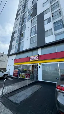 a store front of a tall building with avsoc at APARTAMENTO KELVIN - Edificio ON APARTMENTS in Lima