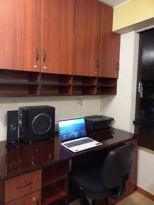 a laptop computer sitting on top of a desk at Frente a hermoso Parque Pueblo Libre in Lima