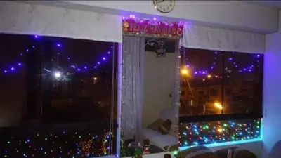 a room with a window with purple lights in a room at Frente a hermoso Parque Pueblo Libre in Lima