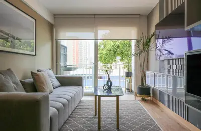 a living room with a couch and a table at Morada by Wynwood House in Lima