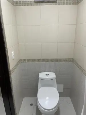a bathroom with a white toilet in a stall at Departamentos Alcanfores 775 Miraflores in Lima