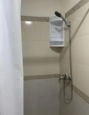 a shower in a bathroom with a shower at Departamentos Alcanfores 775 Miraflores in Lima