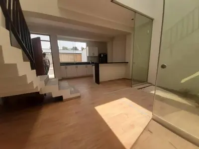 a room with a staircase and a kitchen in a house at Hermosa Casa de Playa km 90.5 in Bujama Baja