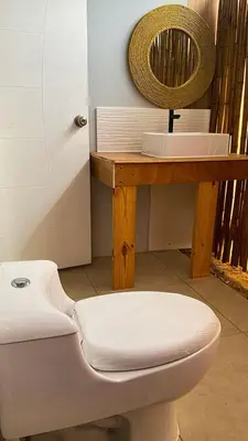 a bathroom with a toilet and a sink at AMAY in Asia