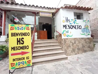 a house with a sign in front of it at Hotel MESONERO in Ayacucho