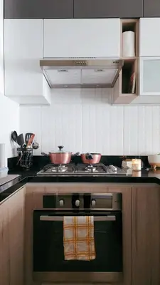 a kitchen with a stove with two bowls on it at Depa acogedor en el corazón de la ciudad in Lima
