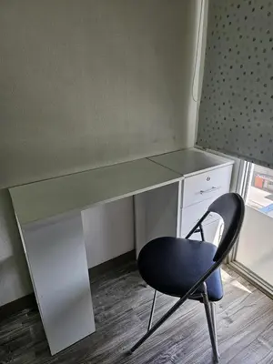 a desk with a chair in front of it at Dpto acogedor con terraza privada in Lima