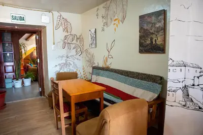 a room with a table and a chair and a table and a table at Casa Antade Cusco in Cusco