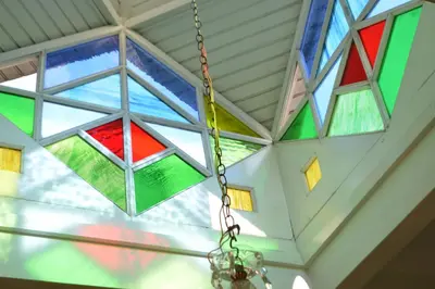 a group of stained glass windows in a ceiling at Collacocha B&B in Lima