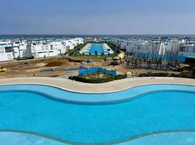 an aerial view of a construction site with a swimming pool at Moderno Departamento con Piscina y Parrilla, 3 min de la playa, Asia in Asia