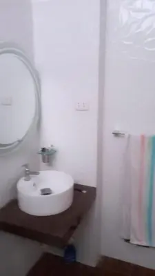 a bathroom with a white sink and a mirror at CASITA PARA FIN DE SEMANA in Rancho Cesar