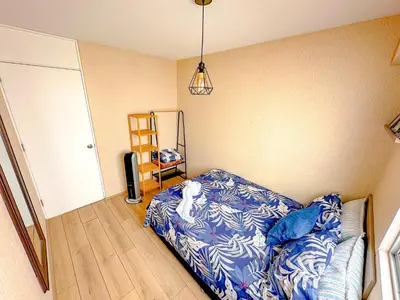 a bedroom with a bed and a television in it at Departamento exclusivo con vista al mar in Lima