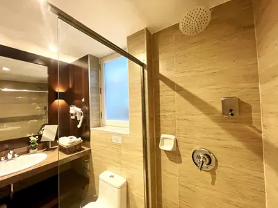 a bathroom with a shower and a toilet and a sink at CASA MONTES PARDO in Cusco