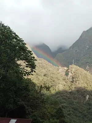 a rainbow in the middle of a mountain at ECO ART Best view Machu Picchu in Machu Picchu