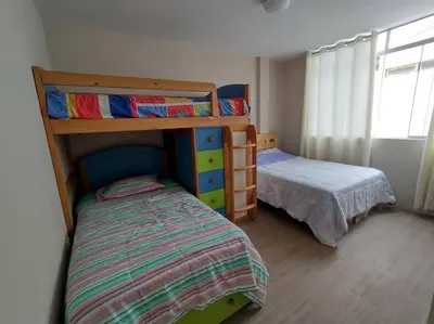 a bedroom with two bunk beds and a bed at L & P Apart Punta Hermosa in Punta Hermosa