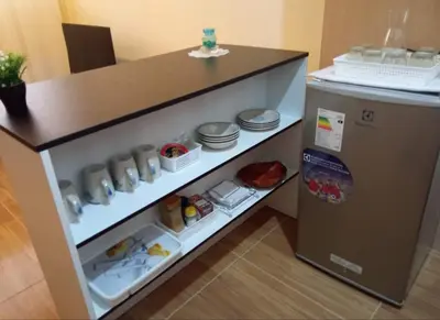 a kitchen with a counter and a refrigerator at Paiva in Lima