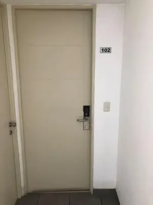 a white door with the number on it at Lindo Apartamento en Condominio Privado in Lima
