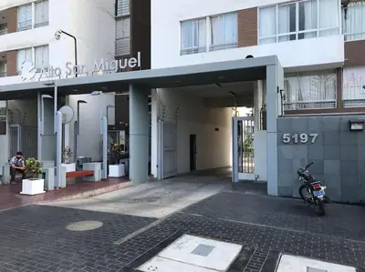 a motorcycle parked in front of a building at Lindo Apartamento en Condominio Privado in Lima