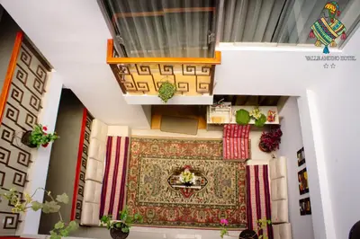 an aerial view of a room with a rug and a balcony at Hotel Valle Andino in Cusco