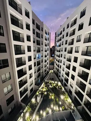 a view of two tall buildings at night at 2BR 2BTH San Isidro Apartment in Lima