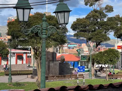 a green light pole with two lights on it at Hostal María Angola in Cusco