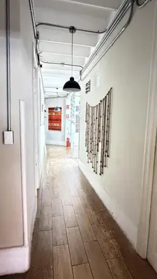 an empty hallway with a tile floor in a building at Casa Porta in Lima