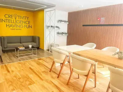 a dining room with a table and chairs and a couch at Apartment with incredible view, pool and gym in Lima