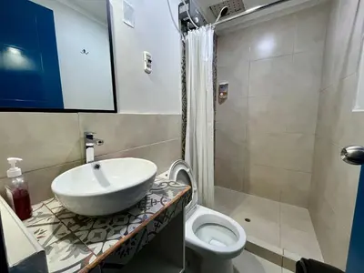 a bathroom with a sink and a toilet at Casa Plaza Bolivar in Quillabamba