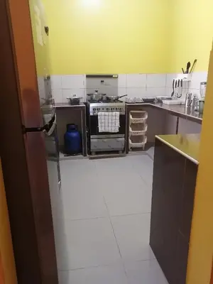 a kitchen with a stove top oven in a kitchen at MI SELVA Y SU ENCANTO in La Merced