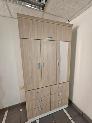 a large wooden cabinet in a room at COZZY APARTMENT IN AYACUCHO in Ayacucho