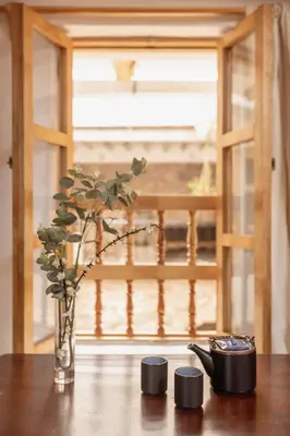a vase with a plant in it sitting on a table at SAMANA B&B in Cusco