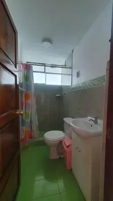 a bathroom with a toilet and a sink at Hospedaje Mary House - En el corazón del Cusco in Cusco