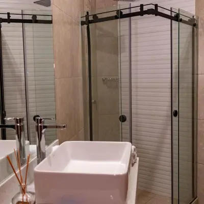 a bathroom with a sink and a shower at Hotel Nebai in Ica